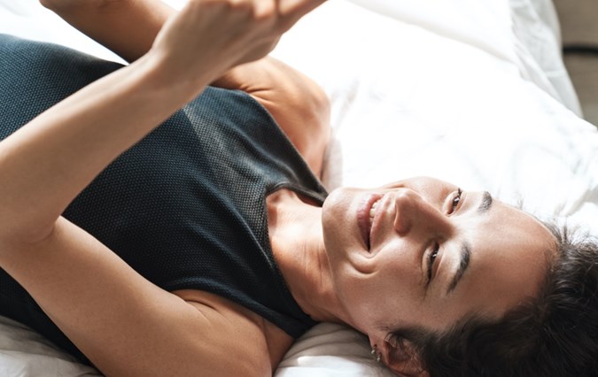 Laying woman with phone